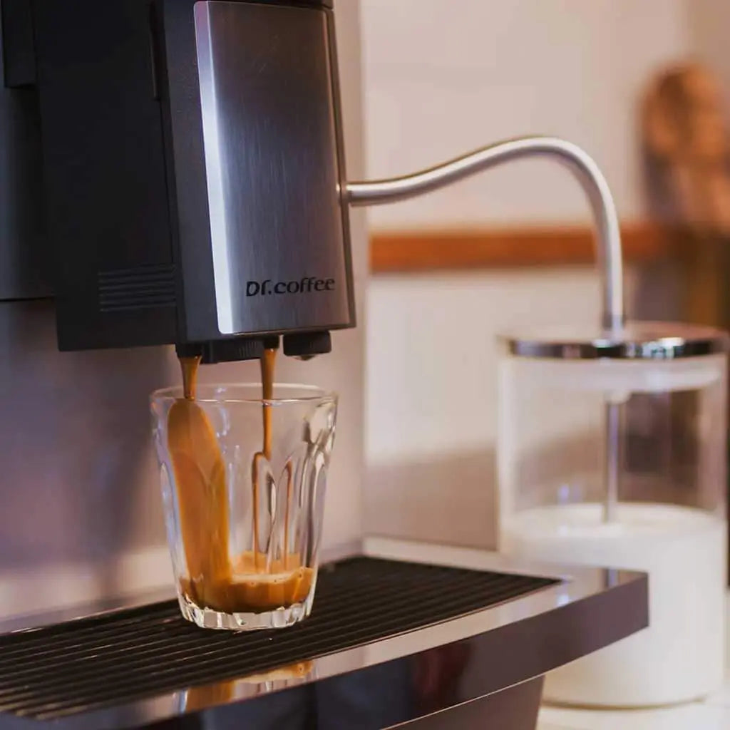 Coffee being poured from a machine into a glass, with 'Di.Coffee' branding.